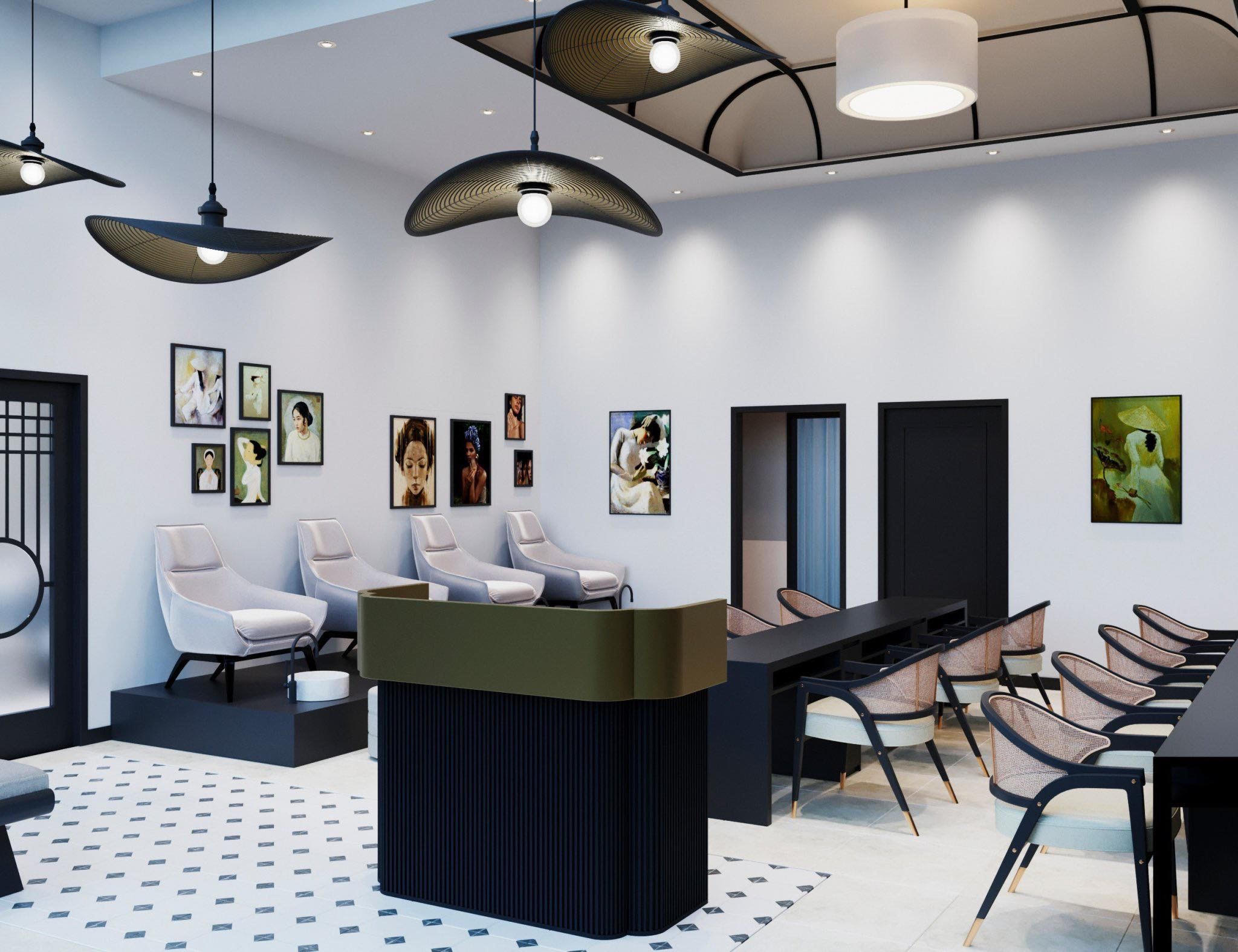 A modern salon interior with pedicure chairs, a black counter, and a seating area. The walls, adorned with framed art, reflect an Indochina-inspired design. Geometric light fixtures hang from the ceiling above a black and white tiled floor, creating a serene ambiance.
